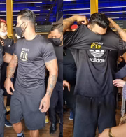 Gusttavo Lima veste camisa de academia ao ser presenteado