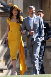 O ator George Clooney e a esposa, a advogada Amal, que é amiga da noiva