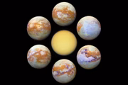 A maior lua de Saturno, Titã, é um mundo gelado cuja superfície é completamente obscurecida por uma atmosfera nebulosa dourada