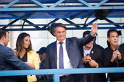 Jair Bolsonaro ao lado da ministra Flávia Arruda no ato de filiação do presidente ao PL