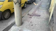 Local em que a criança foi prensada entre poste e carro alegórico