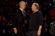 MILWAUKEE, WISCONSIN - OCTOBER 19: NBA commissioner Adam Silver (L) and Milwaukee Bucksead coach Mike Budenholzer of the Milwaukee Bucks meet during a ceremony before the game against the Brooklyn Nets at the Fiserv Forum on October 19, 2021 in Milwaukee, Wisconsin. (Photo by Stacy Revere/Getty Images)