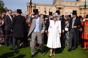 O rei Charles e a rainha Camilla na festa no jardim do Palácio de Buckingham