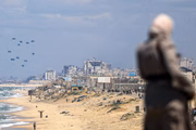 GAZA CITY, GAZA - MARCH 25: Planes drop humanitarian aid around to Gaza City as Israeli attacks continue on Gaza Strip in Gaza City, Gaza on March 25, 2024. (Photo by Yasser Qudaih/Anadolu via Getty Images)