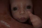 Um dos maiores mistérios do jogo é o bebê que aparece nos trailers, sendo trocado de mão em mão e até aparecendo no final do esôfago de Norman