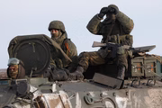 Militares são vistos perto da vila de Oktyabrsky, região de Belgorod, perto da fronteira russo-ucraniana. No início de 24 de fevereiro, o presidente da Rússia, Putin, anunciou sua decisão de lançar uma operação militar especial depois de considerar os pedidos dos líderes da República Popular de Donetsk e da República Popular de Lugansk